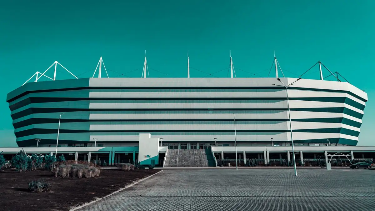 Front view of a modern stadium with unique architectural design captured outdoors.