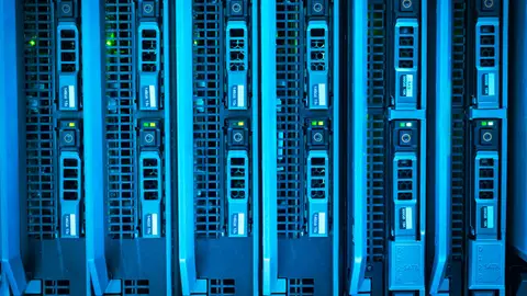 Detailed image of illuminated server racks showcasing modern technology infrastructure.