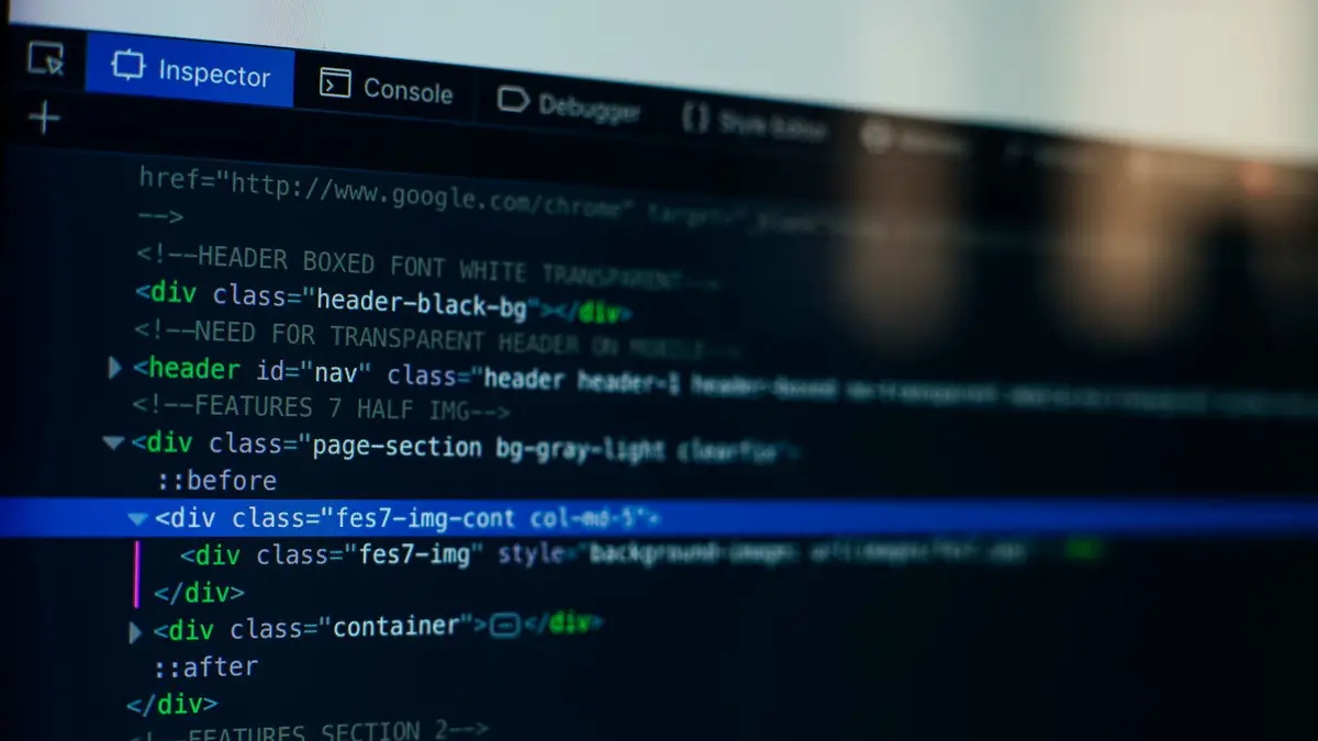 Detailed view of HTML code on a computer screen, ideal for tech and software development themes.