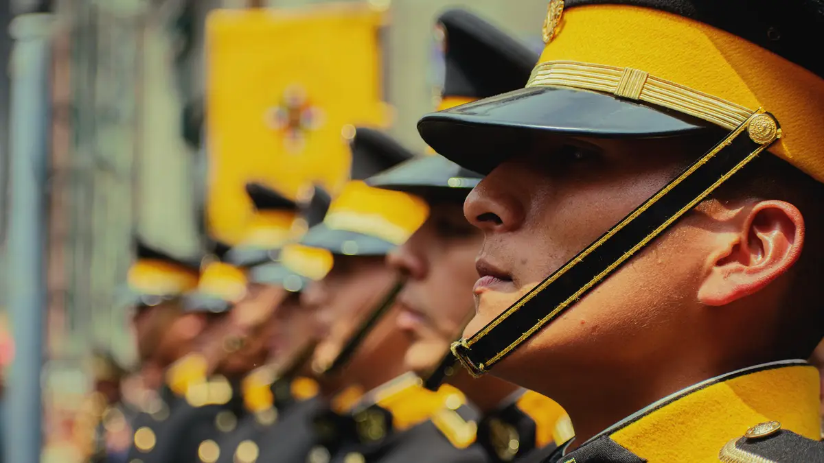 A close-up of uniformed guards in formation during a military parade, showcasing their discipline and coordination.