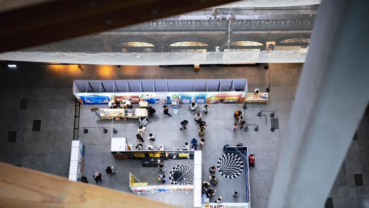 Top view of a bustling indoor exhibition space in Taipei, Taiwan.