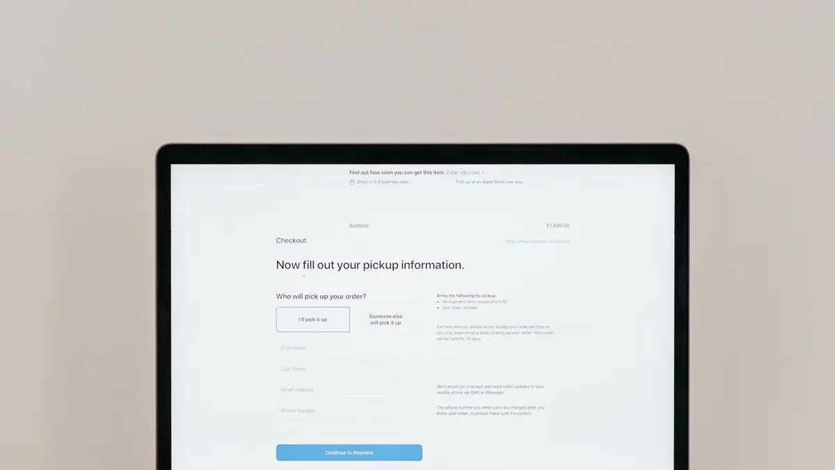 A laptop displaying an online checkout form, highlighting technology and e-commerce.