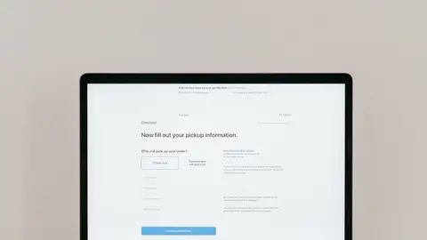 A laptop displaying an online checkout form, highlighting technology and e-commerce.