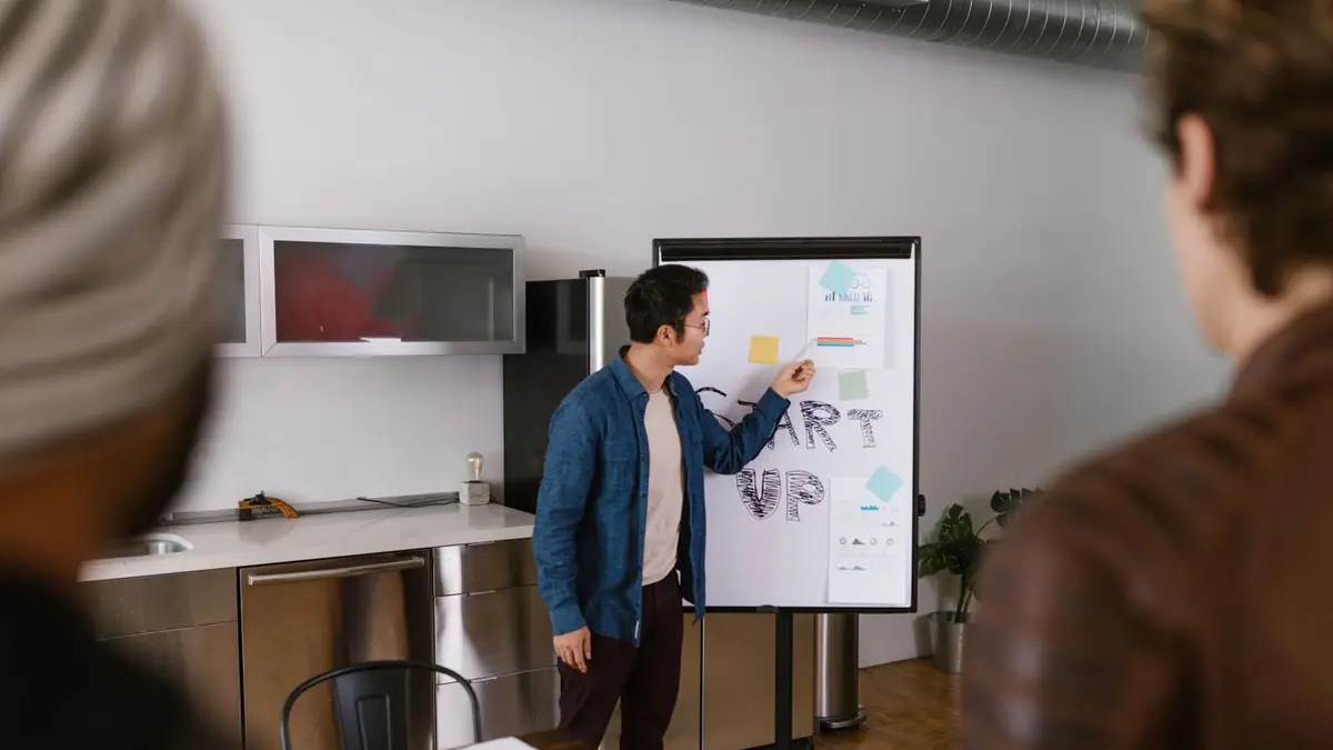 Team members discussing project ideas in a modern office setting.