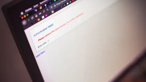 Close-up of a computer screen displaying an authentication failed message.